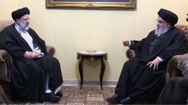 ابراهیم رئیسی رئیس وقت آستان قدس با حسن نصرالله سرکرده حزب‌الله لبنان